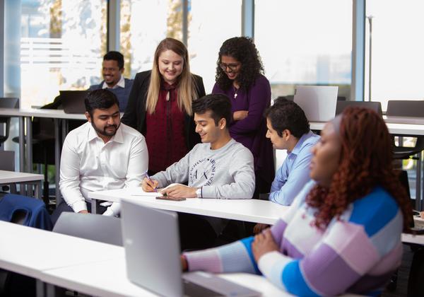A diverse group of students in a classroom.